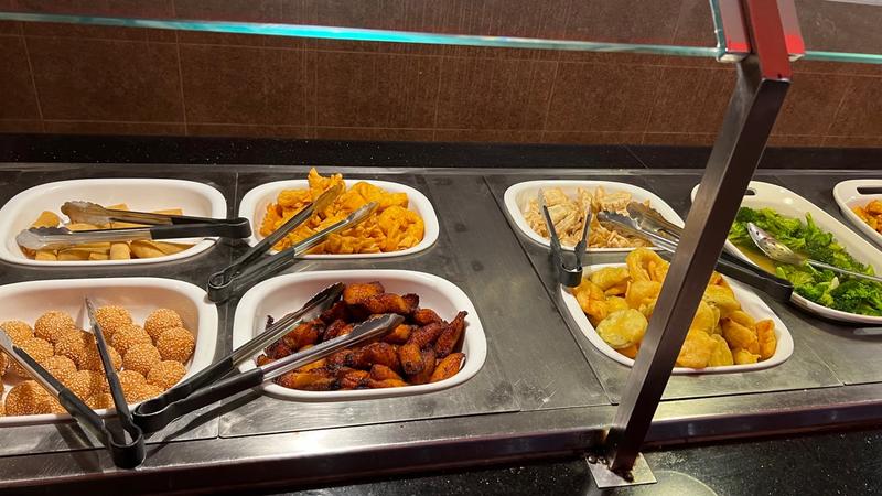 Appetizer station with sesame balls, wings, and dumplings