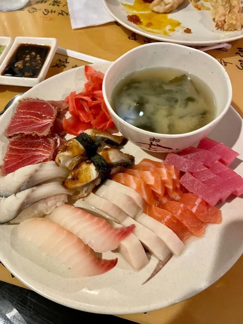 Fresh sashimi platter with salmon, tuna, and miso soup at Aki Japanese Buffet